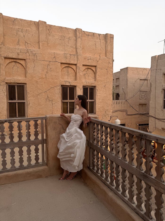 The Bride Standing in the Corner of a Balcony